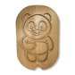 Planche de transvasement Montessori en bois en forme de panda.